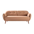 Stylowy różowy sofa z drewnianymi nogami